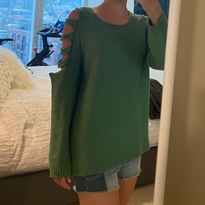 Green sweater with cut sleeves
